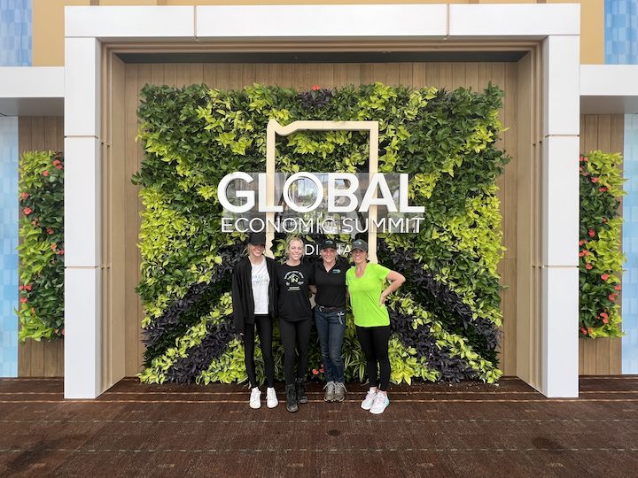 Four members of Great GrowIN's in front of their Living Wall